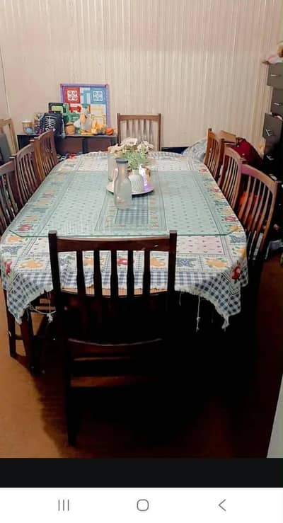 Dining table of solid wood with 8 chairs  JUST LIKE NEW