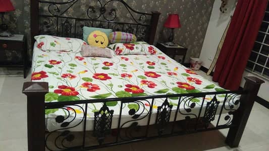 Double bed with two side tables rot iron in good condition