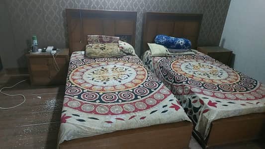 single beds n small wordrobe side table
