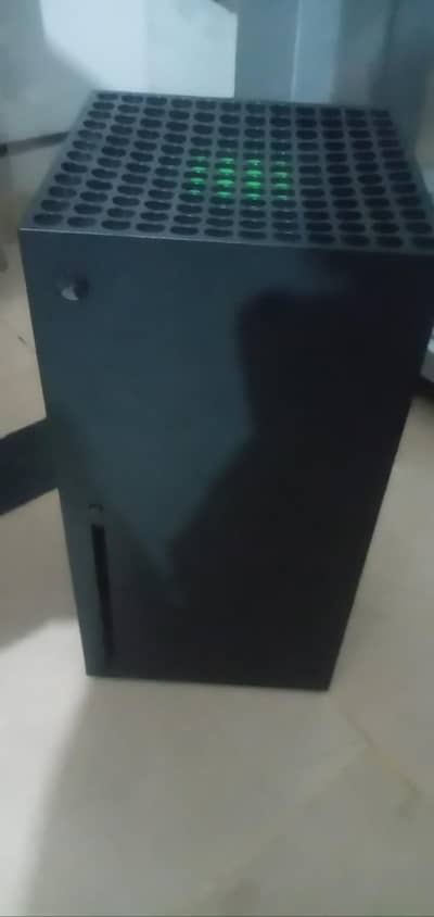 xbox series x with two controllers and one games cd mortal kombat x