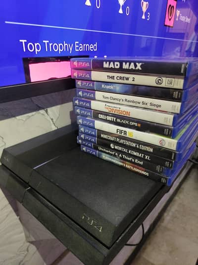playstation 4 with controllers and games