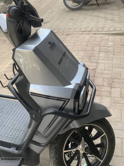 Crown electric scooty