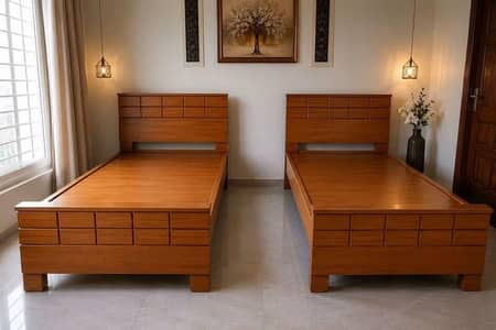 2 wooden single beds