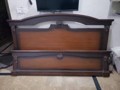 bed with side tables and mirrow