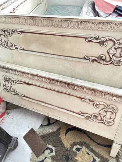 Wooden bed with mattress
