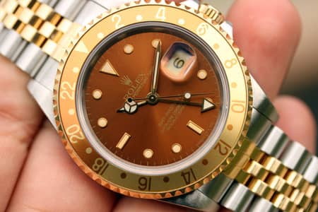WATCH BUYER | Rolex GMT-Master 2 ref. 16713 Rootbeer Omega Seamaster