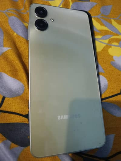 Samsung Mobile A06 4 128 GB Mobil aur charge
