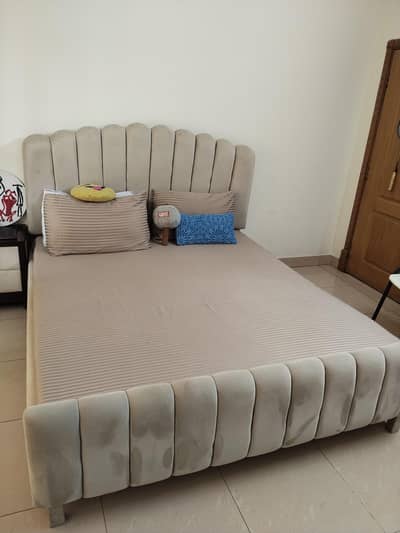 Queen size bed with 2 side tables.
