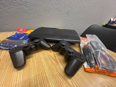 ps3 super slim + 2 controllers + hdml cable good condition + 72 games