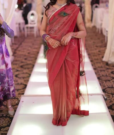 Beautiful pink saree with peacock feathers
