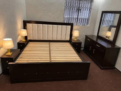 slightly used wooden bed set dressing
