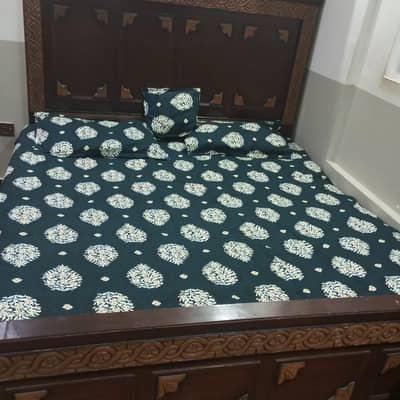 king size bed with side table and dressing