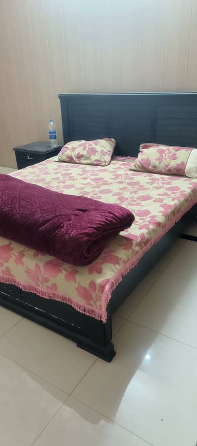 Used bed with side table