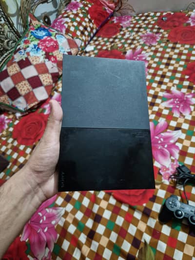 PlayStation 2 Slim in 10/10 condition