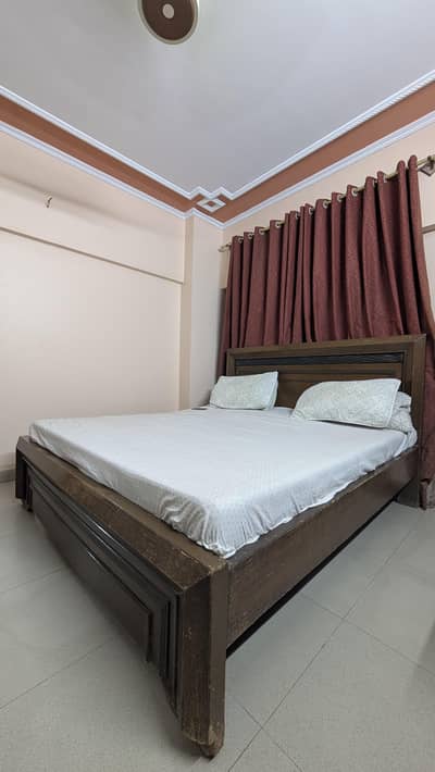 wooden King-sized bed for sale
