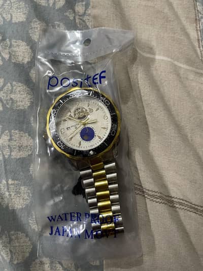 aqua times watch. silver and gold colour