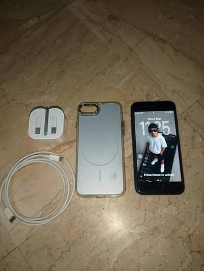 Apple iPhone SE 2 with charger and cable
