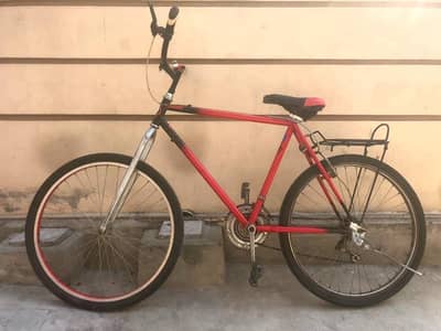 geared cycle | red and black | used