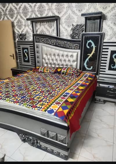 bed with side tables and mirror dressing