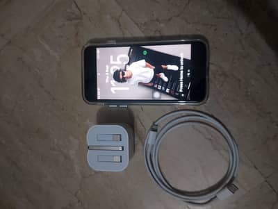 Apple iPhone SE 2 with charger and cable