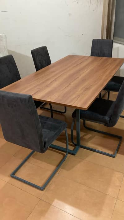 Six chairs with wooden dining table