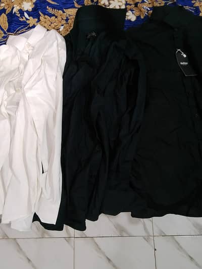 2 Coat pant suits, 3 shirts , tie box and watch available for sale