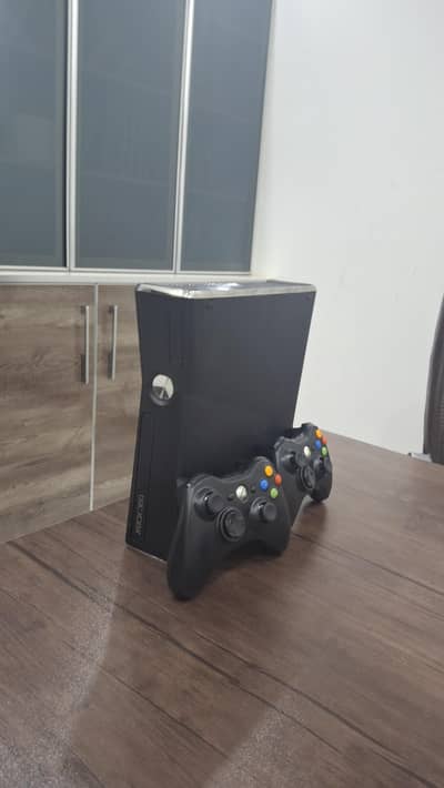 Xbox 360 Slim for sale with two controllers. 500GB storage