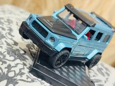 One car colour is orange and sn car is blue