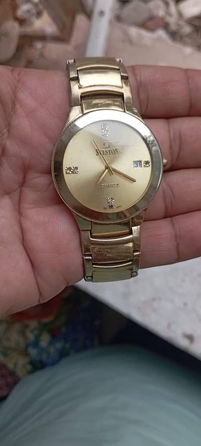 sveston golden watch