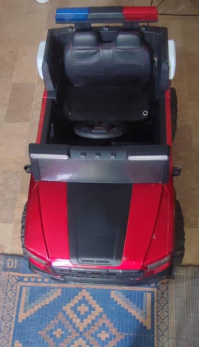 NEW LIKE CONDITION, KIDS CHARGING CAR WITH REMOTE CONTROL