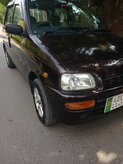 Daihatsu Cuore 2012 better than mehran cultus alto santro swift platz