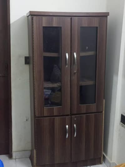 4 door wooden cabinets -needs repair broke. shelf + water damage