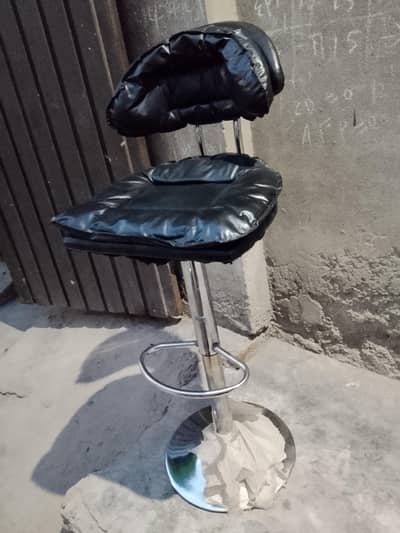 Black color hydraulic revolving bar chair for sale.