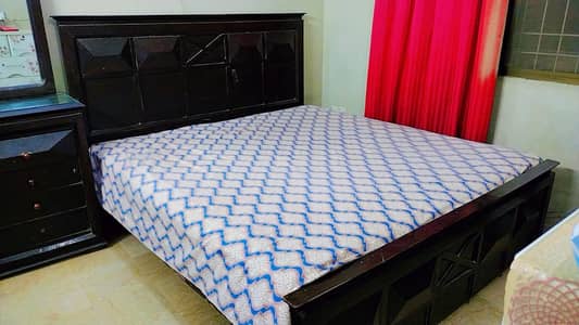 king double bed with two sides and dressing table