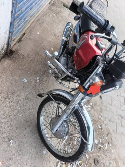 Honda 125 Self start Red color good condition for urgent sale