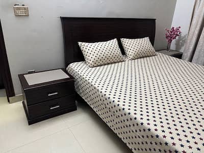 Double bed with two side tables without mattress