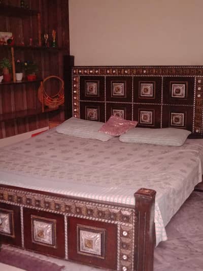 used bed with two side tables