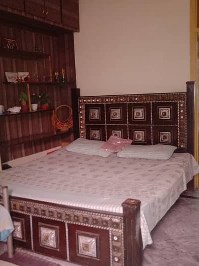 used bed with two side tables
