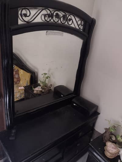 wooden bed and dressing