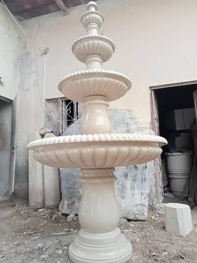 outdoor fountain and water fall and lawn designig