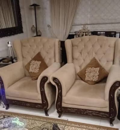 Pair of Classic Tufted Wingback Armchairs with Carved Wooden Frame