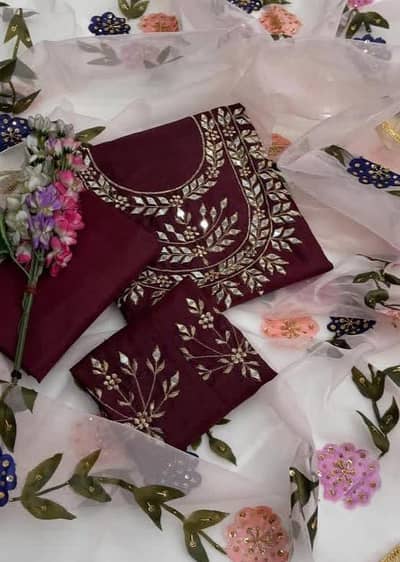 woman unstitched dark red colour dress