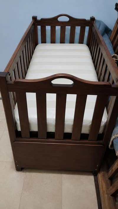 Handcrafted Wooden Baby Cot with Integrated Storage and Mattress