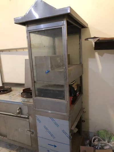 Stainless steel counters with two burners and showcase