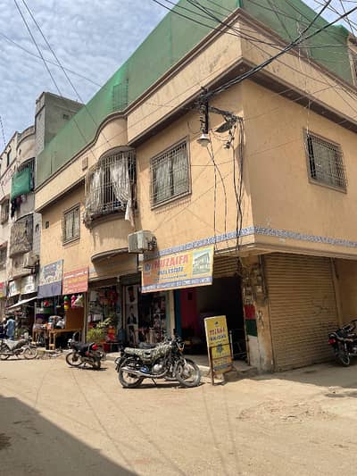 90 sqyard corner house with 4 commercial shops at block 1 metroville 3rd scheme 33 Gulshan e iqbal
