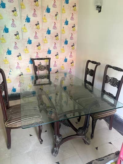 Wooden and glass Dining table with 6 chairs slightly used ,65 k price