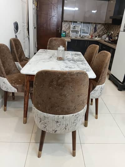 marble top woden dinning table with six chairs