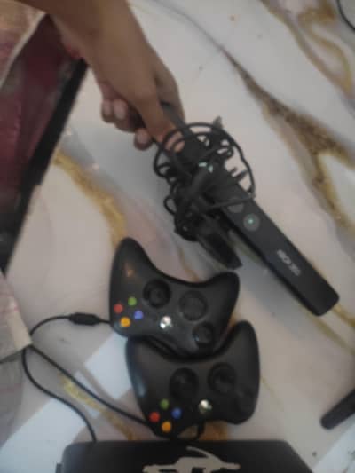 Xbox 360 with two controllers