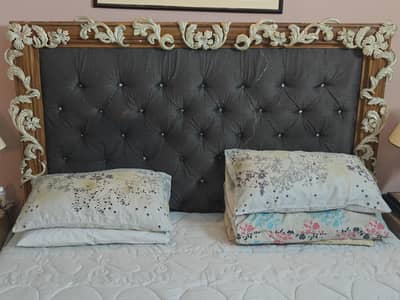 King size bed with side tables and mirrors