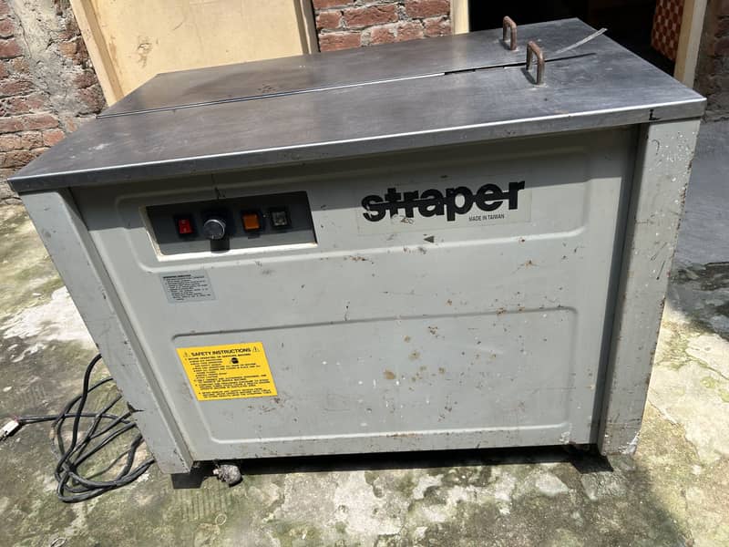 Semi-automatic box strapping machine 0